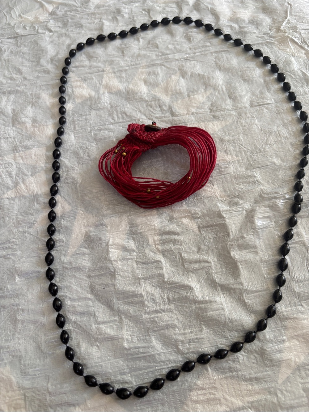 Elegant Black Beaded Necklace with Red Multi-Strand Accent